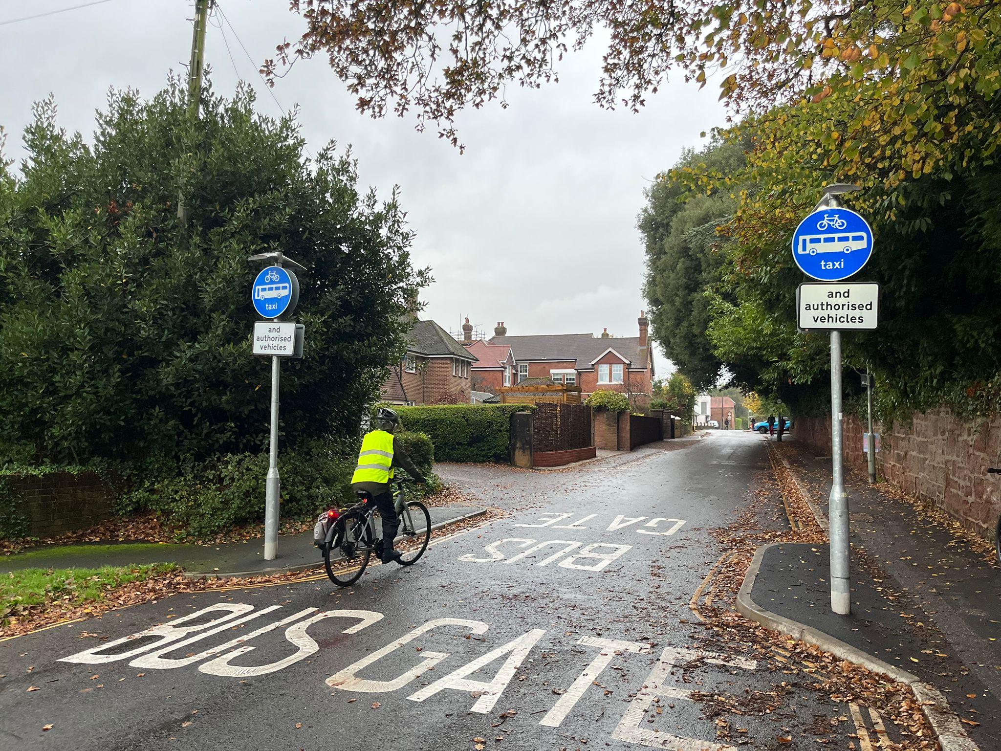 Woman on bike Wonford bus gate